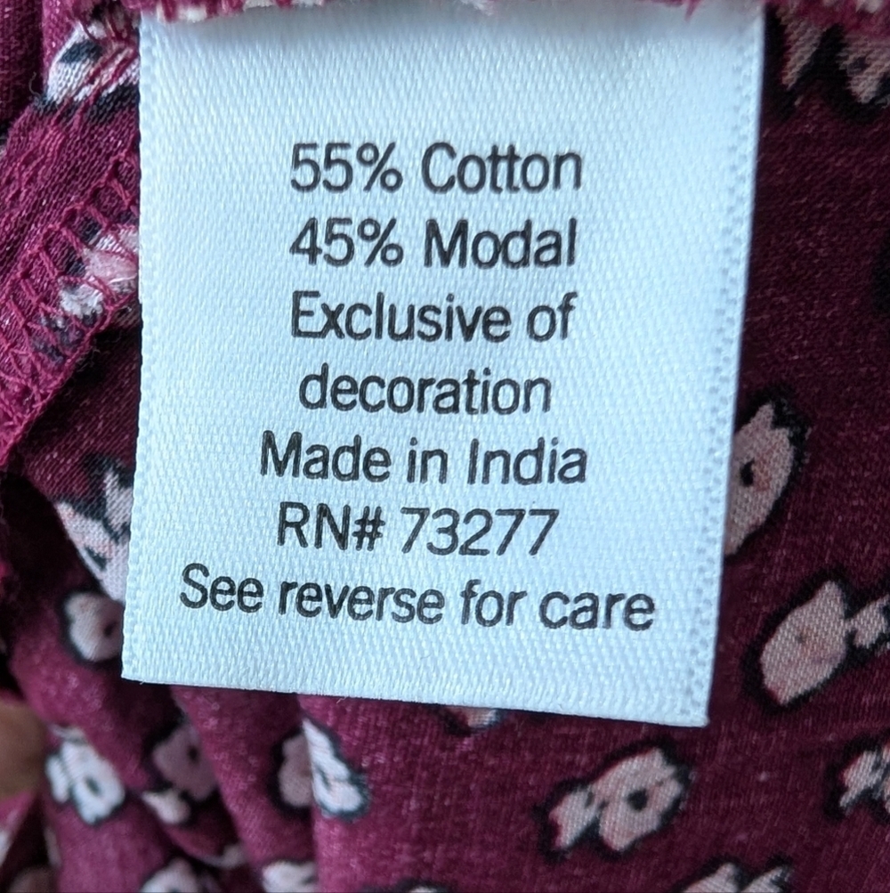 Floral Smocked Wrist Henley with 1/4 Button Down Closure In Plum - Picture 8 of 8